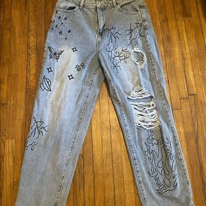 Blue jeans with rips and design
